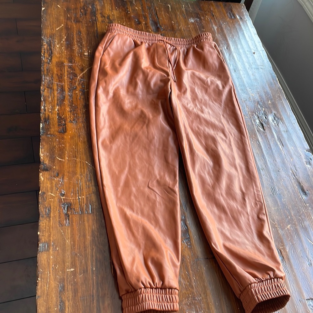 ASOS new look leather look sweatpants in rust